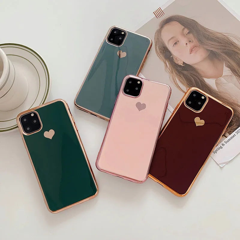 Simple solid-colour TPU back cover case for iPhone on a table, showing blue colour option.