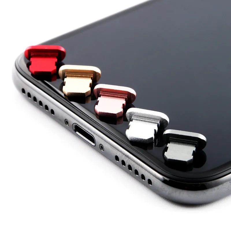 Aluminium alloy dust plug for iPhone charging port in gold, silver, blue, red, grey, black, and rose gold colours.