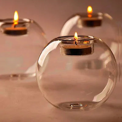 Clear handmade hollow glass spherical candle holder in European style.