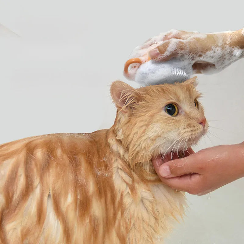 Orange TPR dog bath brush with shampoo dispenser and curved pumpkin grip design
