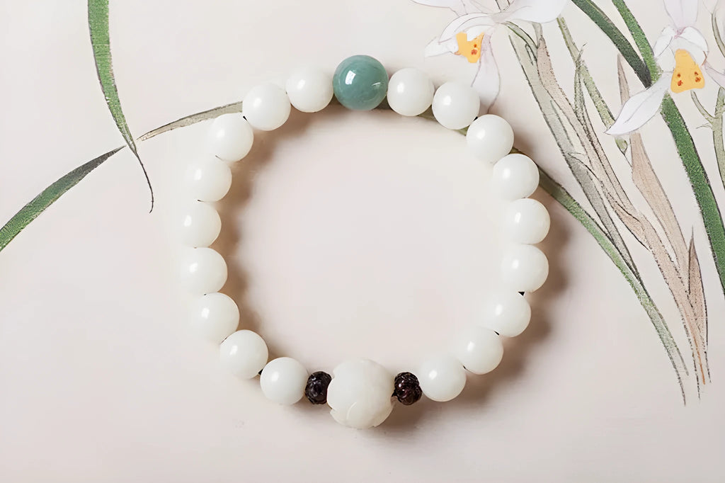 Natural white jade Bodhi bracelet with round beads and transfer bead on white background