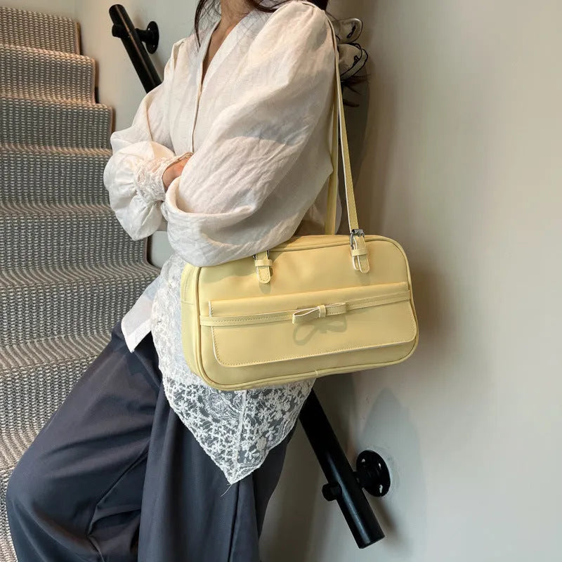 Women's black PU leather single-shoulder bag with flap closure and double straps showing internal mobile phone compartment