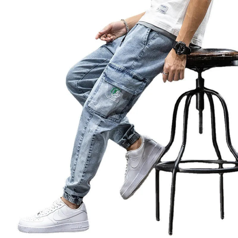 Men's straight leg cargo casual jeans in cotton, showing Korean style and skinny open leg.