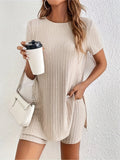 Women's grey ribbed cotton two-piece pyjama set with crew neck top and shorts on a hanger.