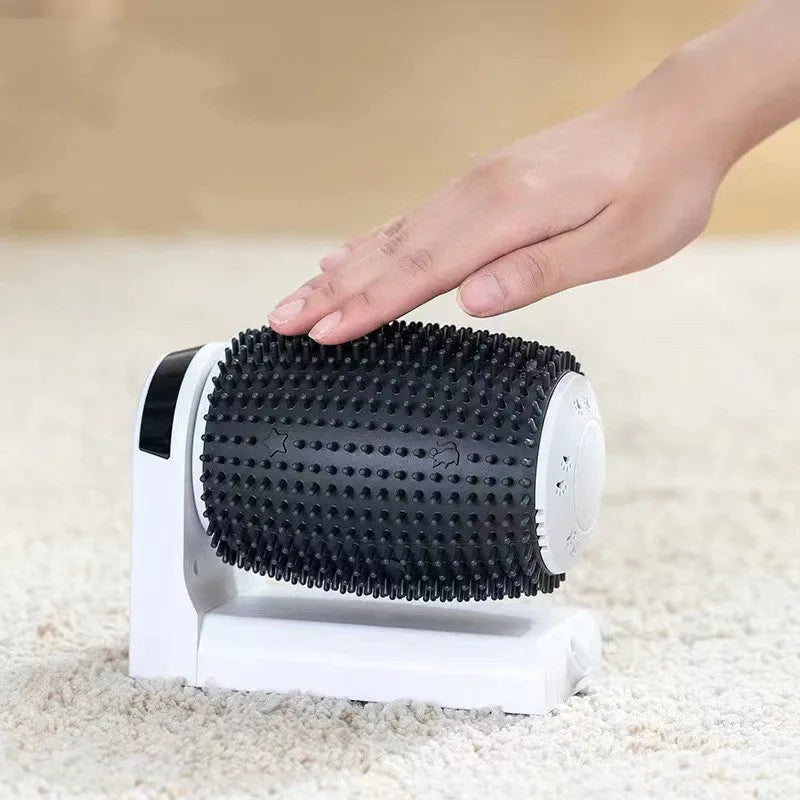 White automatic cat self-groomer with silicone bristles mounted in a corner.
