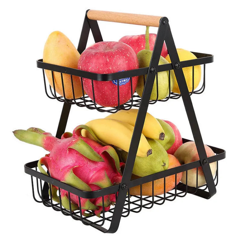 Black detachable double-layer iron fruit basket with wooden handle on tabletop