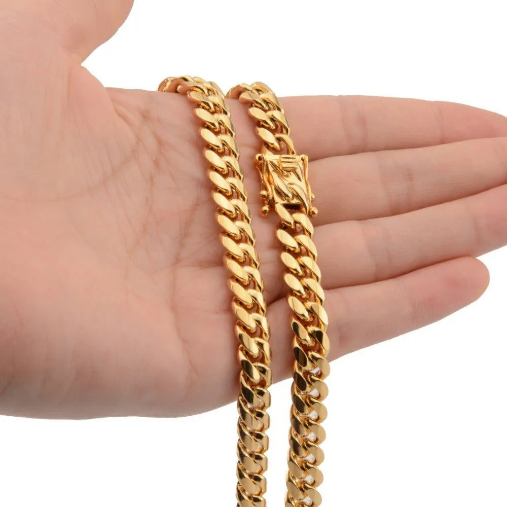 Gold Miami Cuban link stainless steel chain necklace on white background