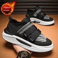 Men's black and gray striped lace-up platform sneakers with cotton upper and PVC sole on display