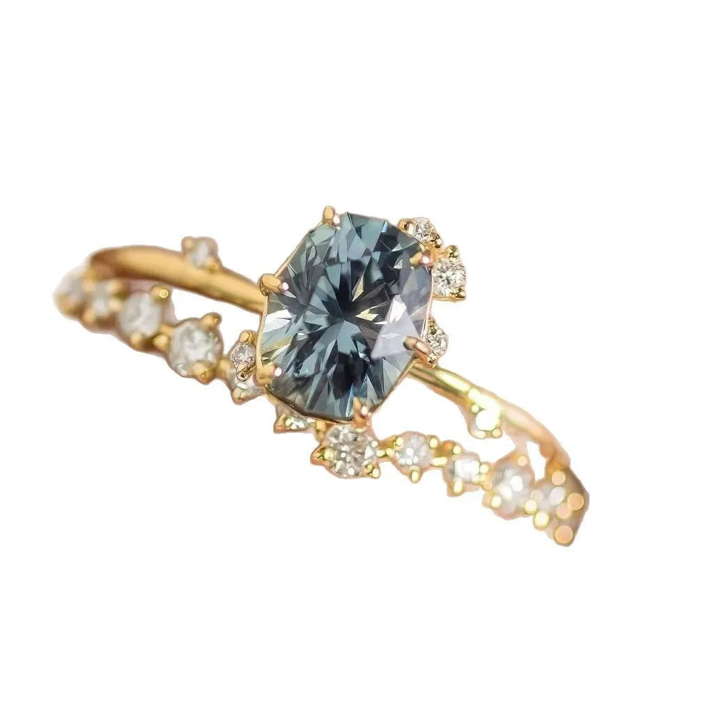 Gold-plated women's ring with green zircon stone in floral design on finger
