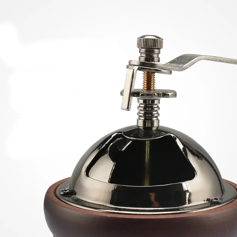 Manual coffee machine with solid wood barrel grinder and hand crank in coffee colour