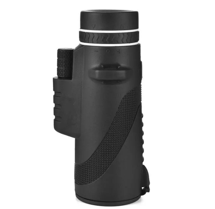 Black 40x60 monocular telescope with mobile phone attachment for photography on a table.