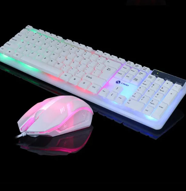 Wired gaming keyboard and mouse set with rainbow backlight and floating keys in black on a desk