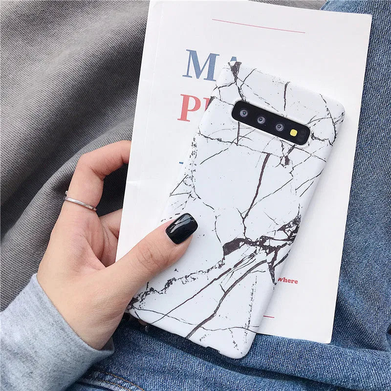 Samsung Galaxy phone back cover case with a white and grey marble pattern design