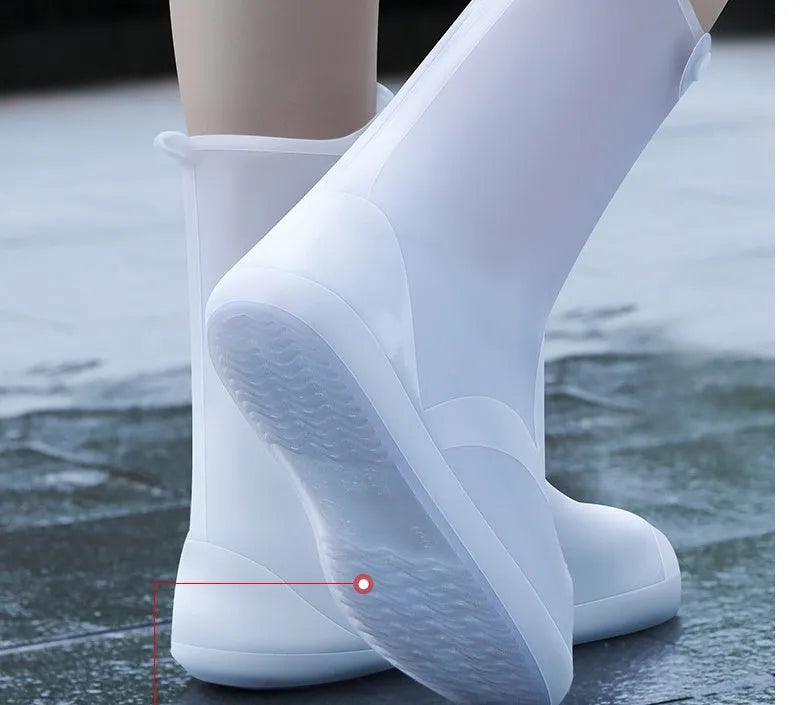White high top PVC reusable water resistant shoe covers for women with anti-skid soles.