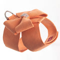 A cute pink microfiber puppy chest strap with a bowknot, showing the adjustable design.