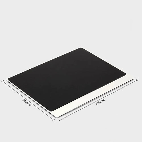Alloy extended mouse pad in black on desk with keyboard and mouse, showing oversize surface
