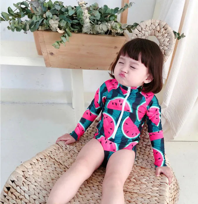 Cool watermelon children's long sleeve swimsuit set with fruit print on a white background