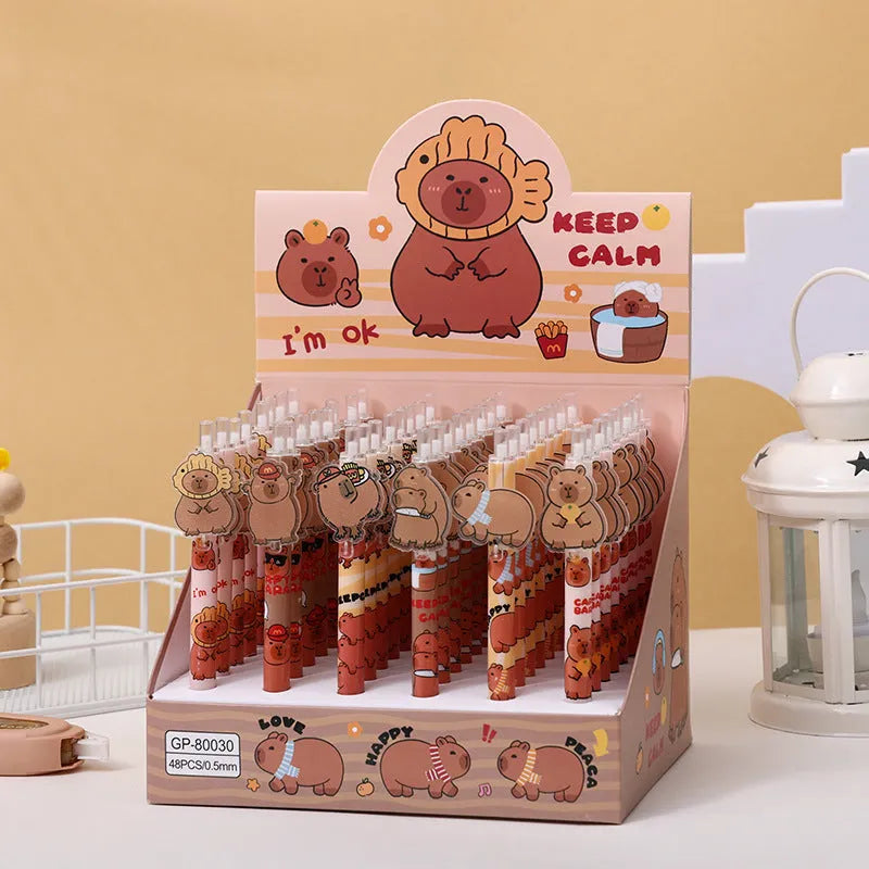 Open box showing 48 cartoon bear themed plastic gel pens with press barrels.