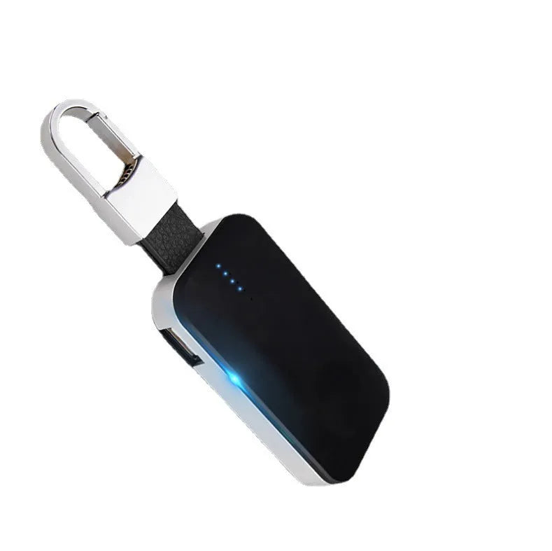 Black portable Apple Watch wireless charging power bank on a keyring.