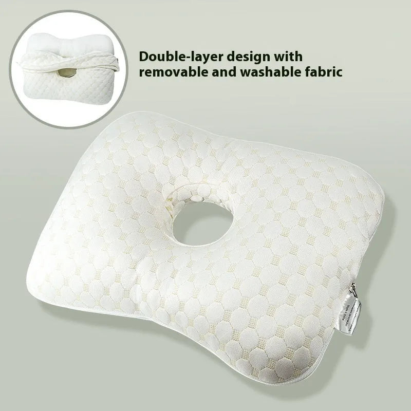 Beauty salon single hole ear pillow in grey on a treatment bed.