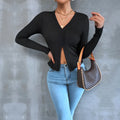 Black women's long sleeve slim fit cropped T-shirt with split neck and slit detail, sizes XS-XL
