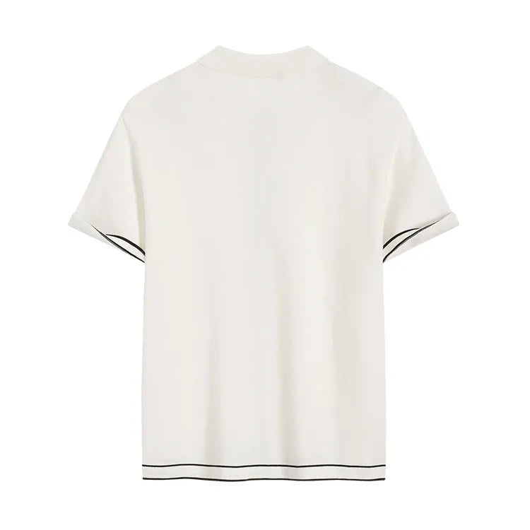 White short-sleeve cardigan with dark contrast colour lapels, buttoned front, on a hanger.