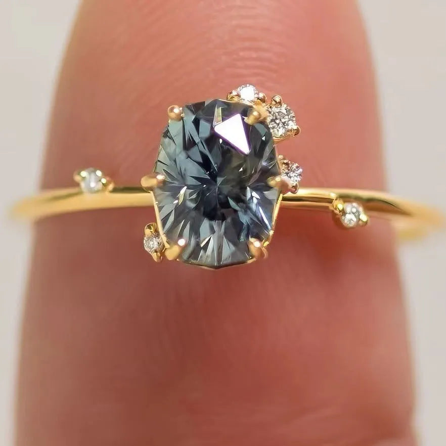 Gold-plated women's ring with green zircon stone in floral design on finger