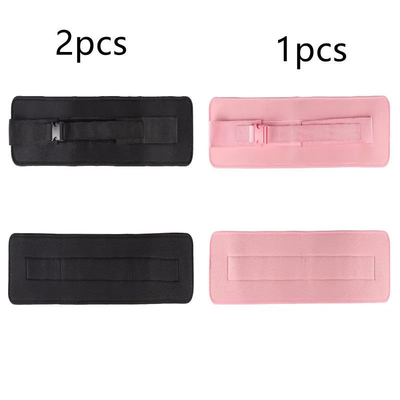 Black fitness training belt with auxiliary strap for weight-bearing hip bridge exercises