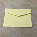 Pack of ten mini coloured paper envelopes in various shades, sized for business cards.