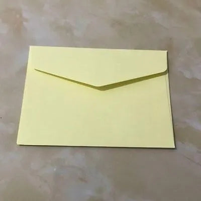 Pack of ten mini coloured paper envelopes in various shades, sized for business cards.