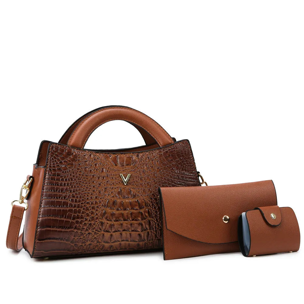 Women's square black crocodile pattern crossbody handbag with visible stitching and a single shoulder strap.