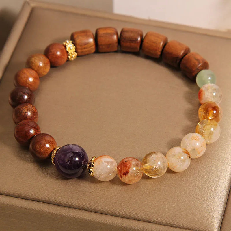 Women's bracelet with yellow tower crystal and amethyst beads, pearl and rhinestone accents