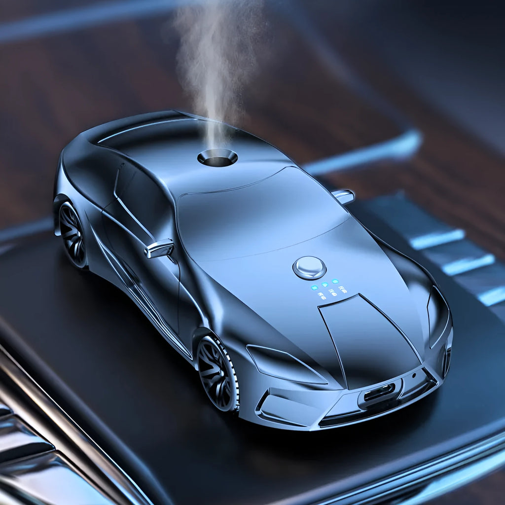 Grey cartoon car model aromatherapy diffuser in aluminium alloy, 12.9 cm x 5.9 cm x 3.7 cm, with three essential oil bottles.