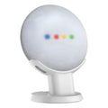 Black or white plastic stand holding a Google Home Mini voice assistant on a desk.