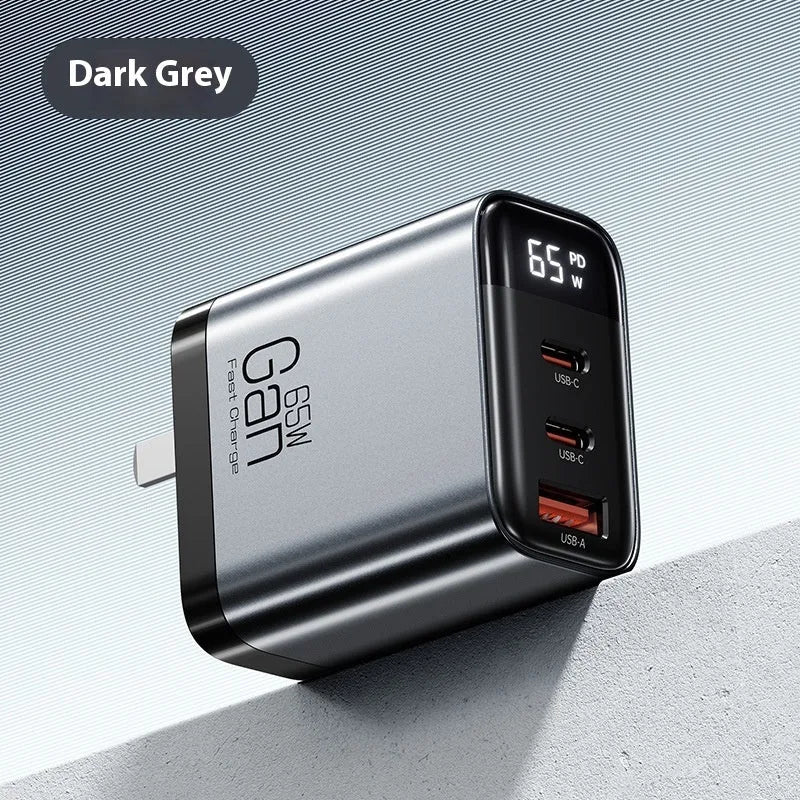 Gallium nitride three-port 65W charger with smart digital display in black, showing Type-C port