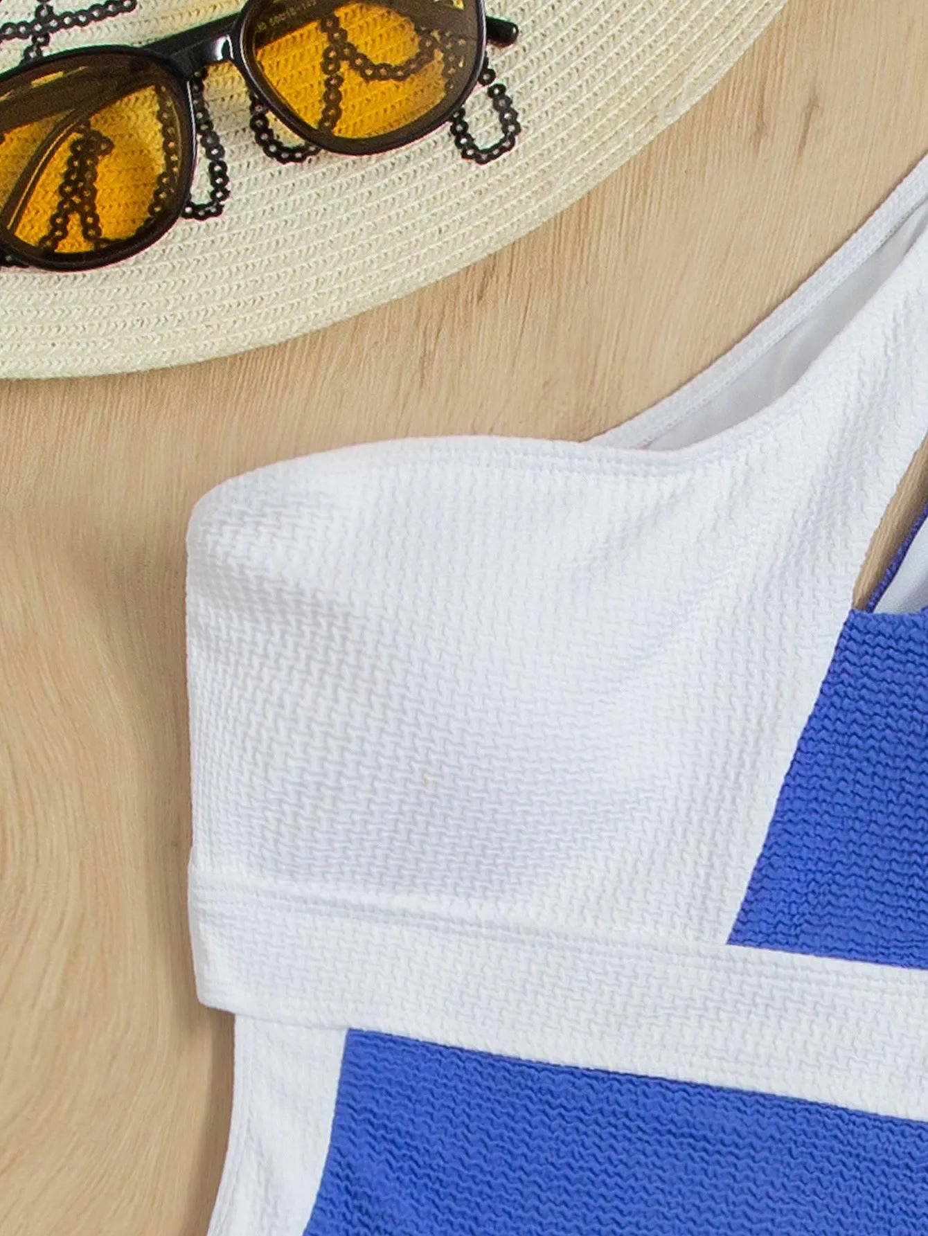 One piece colourblock swimsuit in blue and white, ladies bikini style with chest pad, polyester fabric.