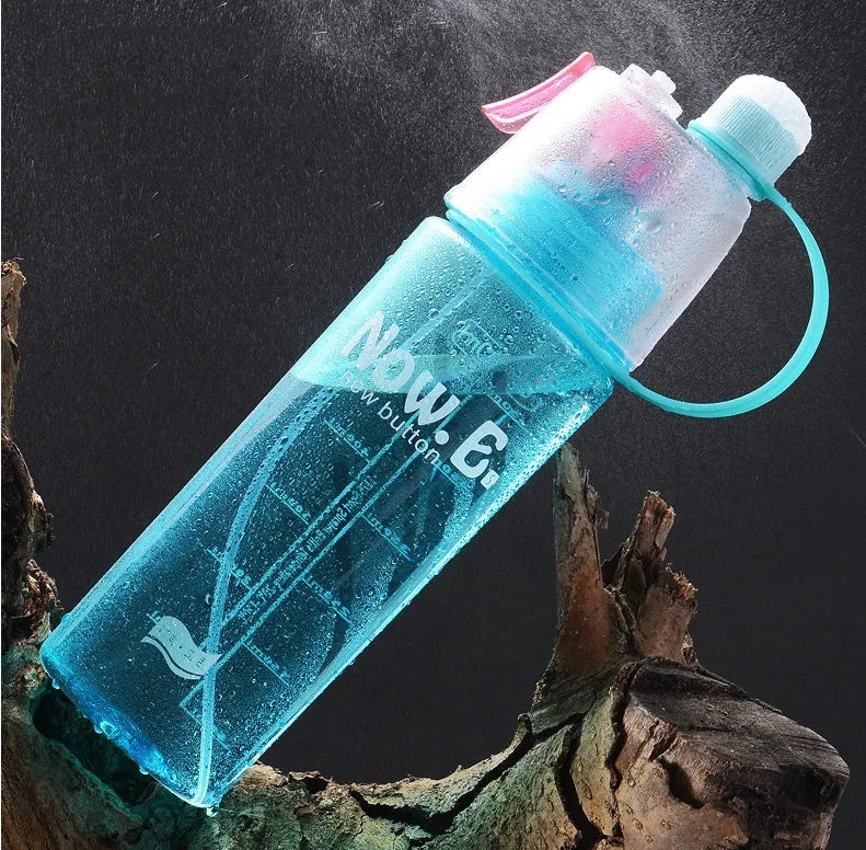 Portable green outdoor mist spray cup with handle, scale, and leakproof pad.