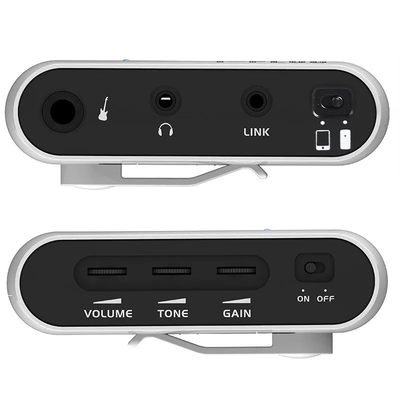 White metal portable headphone amplifier with multi-effects distortion, shown with batteries and connector.
