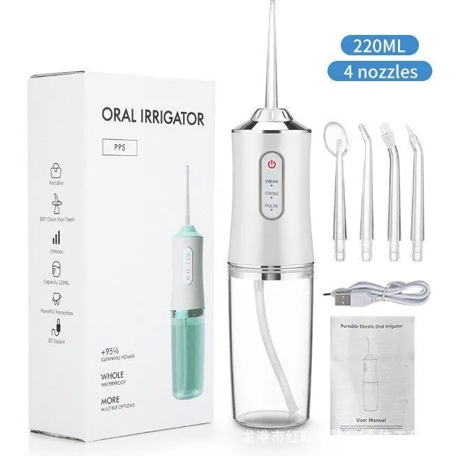 Pink portable electric water flosser with replaceable nozzles and large water tank on bathroom counter