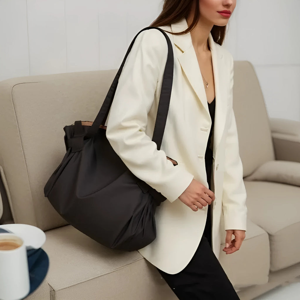 Women's large capacity Oxford cloth crossbody shoulder bag in black or light brown for travel and camping.