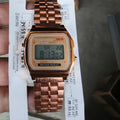 Rose gold analogue watch with round stainless steel case, luminous hands, and date display on a white background