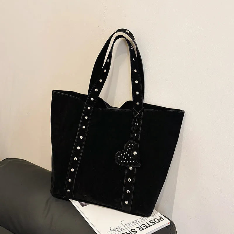 PU tote bag with double shoulder straps in black showing horizontal square shape and sandwich pocket exterior