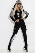 Black women's casual suit with wings print, featuring a hooded zip top and matching trousers.