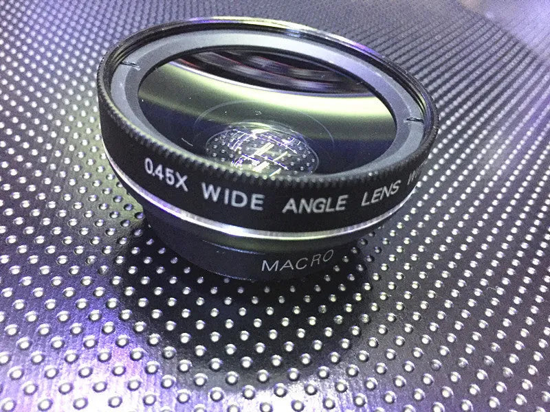 0.45X wide-angle mobile phone camera lens in silver finish attached to smartphone