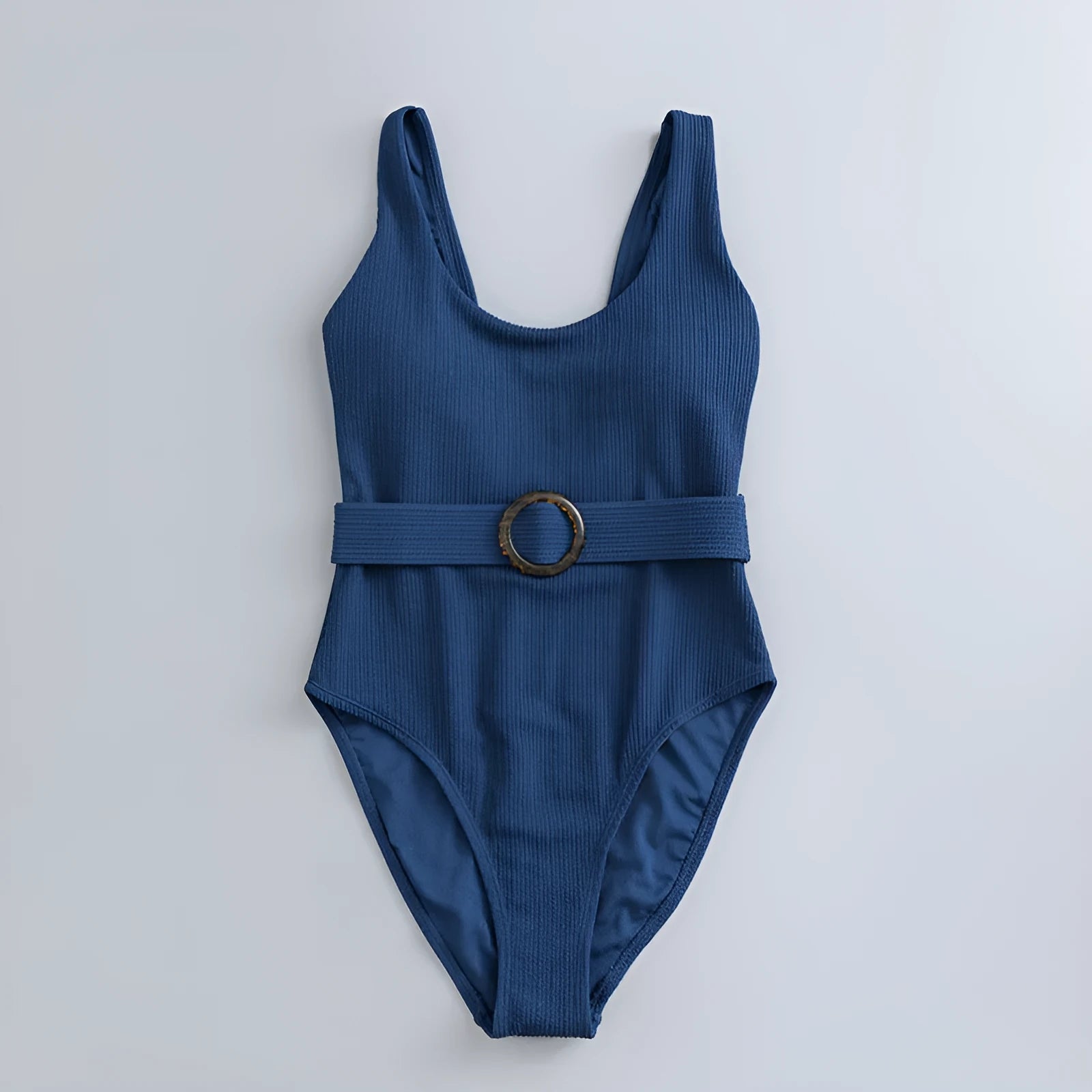 Navy blue women's one-piece swimsuit with triangle cut and chest pads on size chart