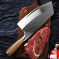Forged stainless steel kitchen knife with a 320mm blade on a wooden cutting board.