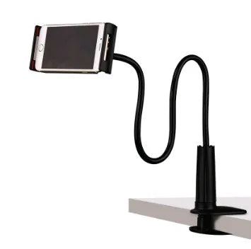 Black bedside oversize flat panel phone holder with long flexible arm mounted on a wooden table.