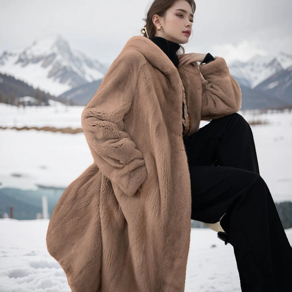 Long brown leopard print artificial fur coat for women on a hanger, showing its loose, lengthened fit.