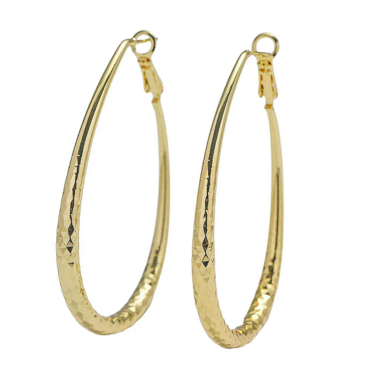 Gold glossy egg-shaped spring fastener earrings made from hypoallergenic copper, unisex geometric design