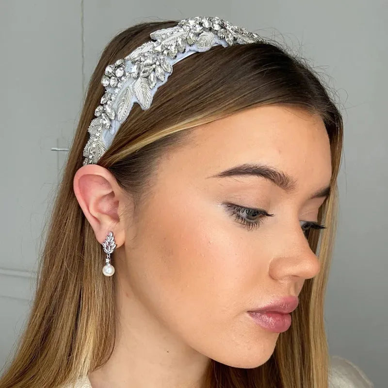 Geometric flower earrings with micro inlaid zircon in gold, rose gold, and white gold plated finishes.